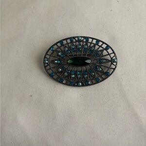 Elegant Oval Brooch with Green and Blue Accents